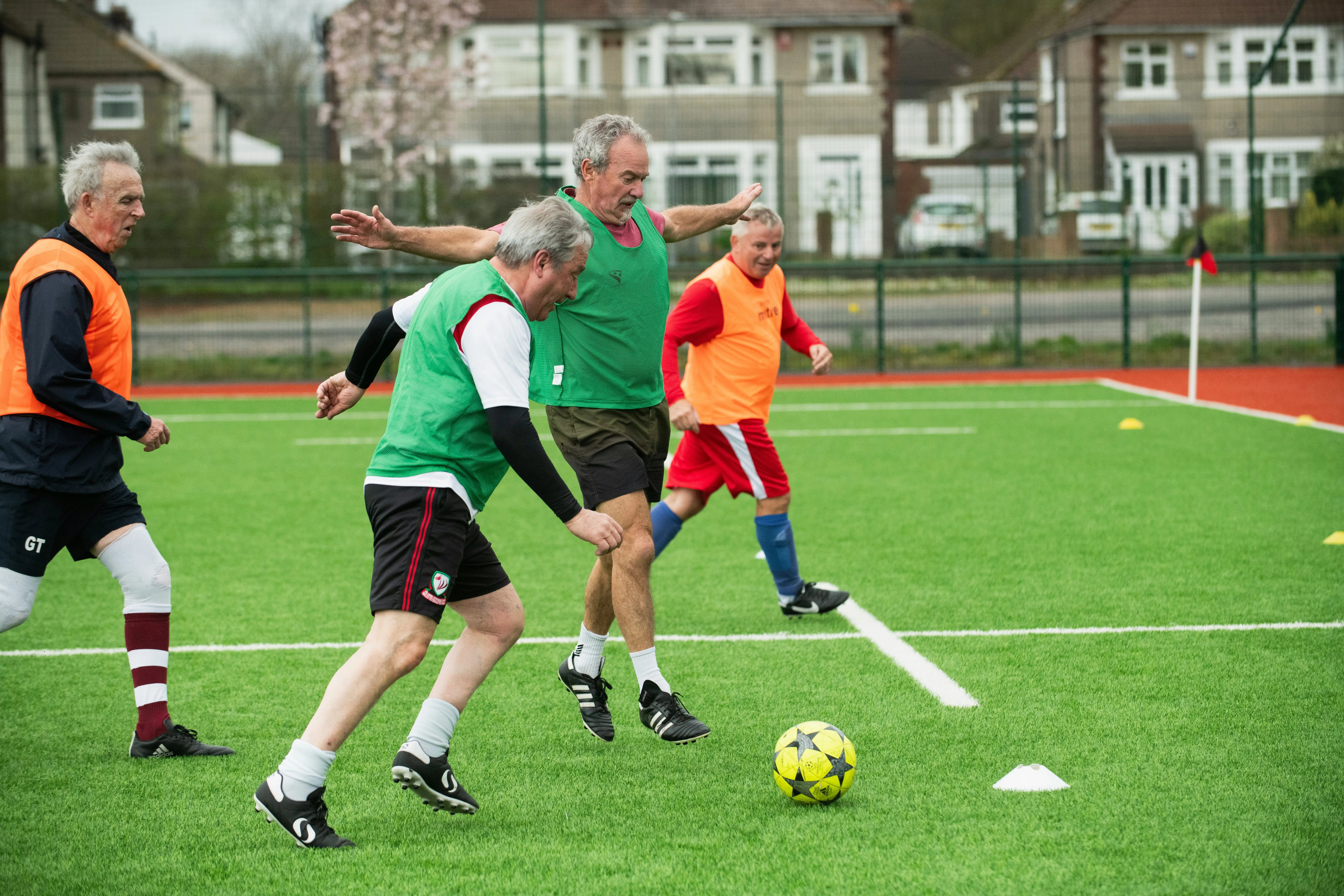 Older adults playing soccer. Adult play matters.