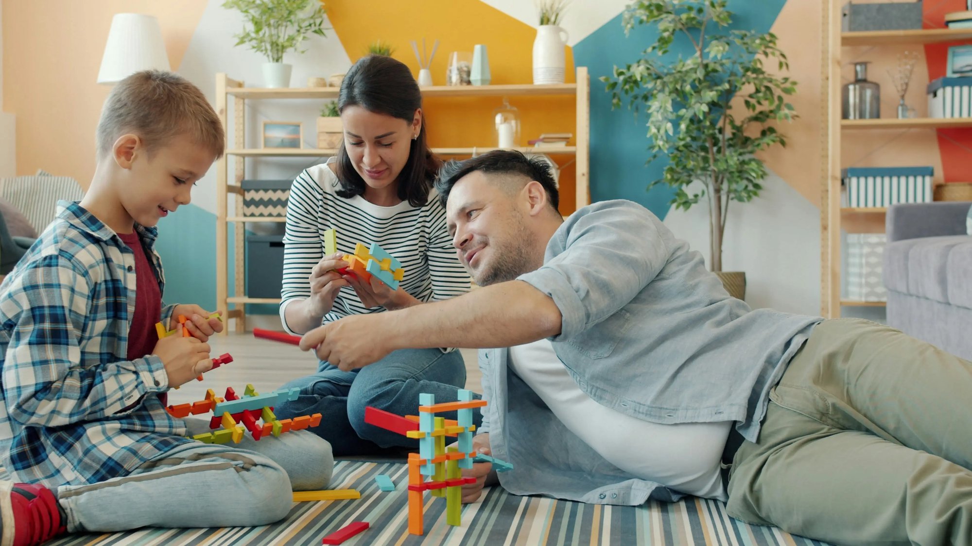 Family playing with objects together. Object play matters.